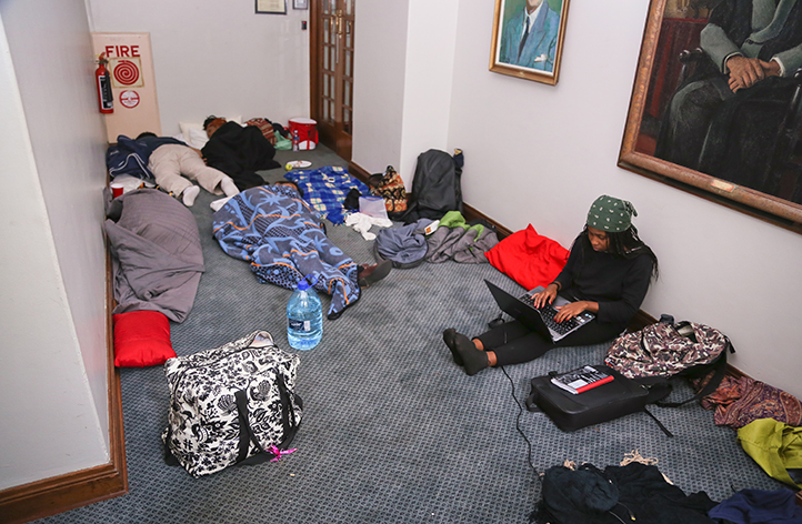Seminars, teach-ins and debates were the order of the days and the nights in Azania House. Here, students catch up on sleep and work. Photo by Je&rsquo;nine May.