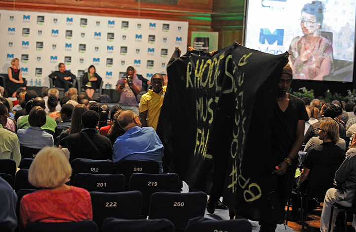 Students holding a silent protest during the Man Booker International Prize panel discussion at Jameson Hall on 23 March. They entered the hall with a black banner and posters and stood in silence in front of the stage for 10 minutes before leaving. Photo by Michael Hammond.