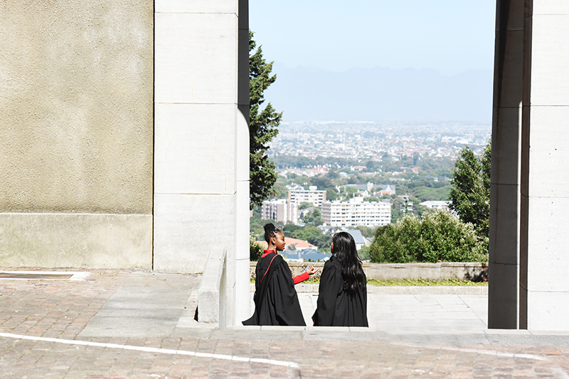 Two Faculty of Health Sciences graduates having a conversation outside Memorial Hall after their graduation ceremony. The December graduation ceremonies, held on Wednesday 20 December, ended the academic year at UCT. 