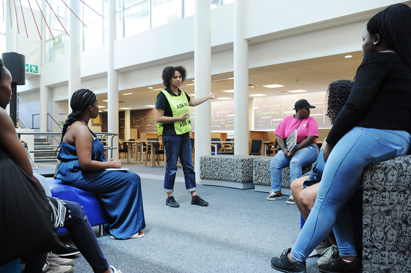 A library assistant explains how the Chancellor Oppenheimer Library operates, during a tour of the UCT libraries with first-year students.