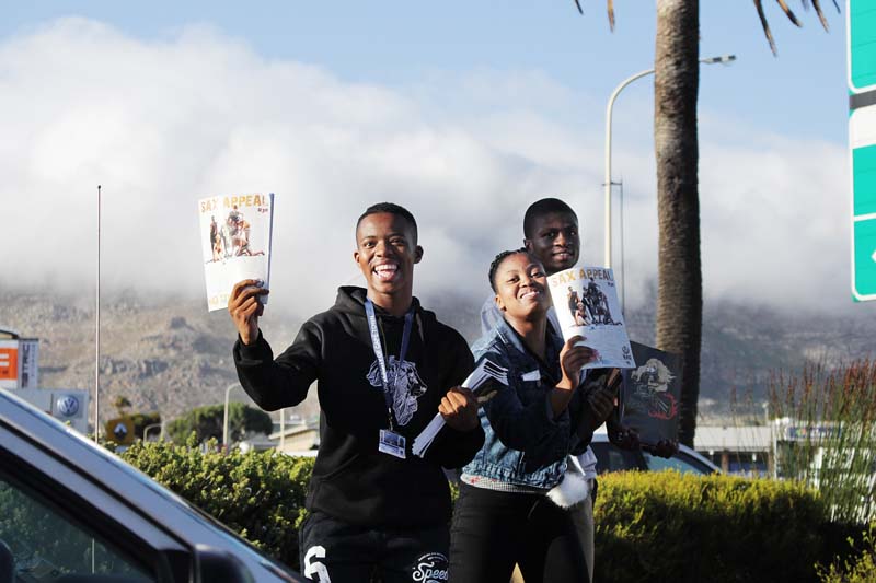 First-year students sell the annual Sax Appeal magazine on the corner of White and Main roads, Tokai.