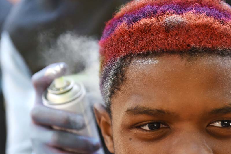 A health sciences student opted for a rainbow effect during the annual CANSA Shavathon.