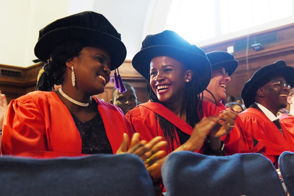 PhD students enjoy their first moments after being capped.