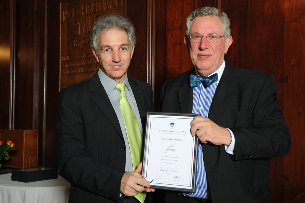 Former UCT Registrar Hugh Amoore receives his long-service award from Dr Price in 2009, after 35 years of service.