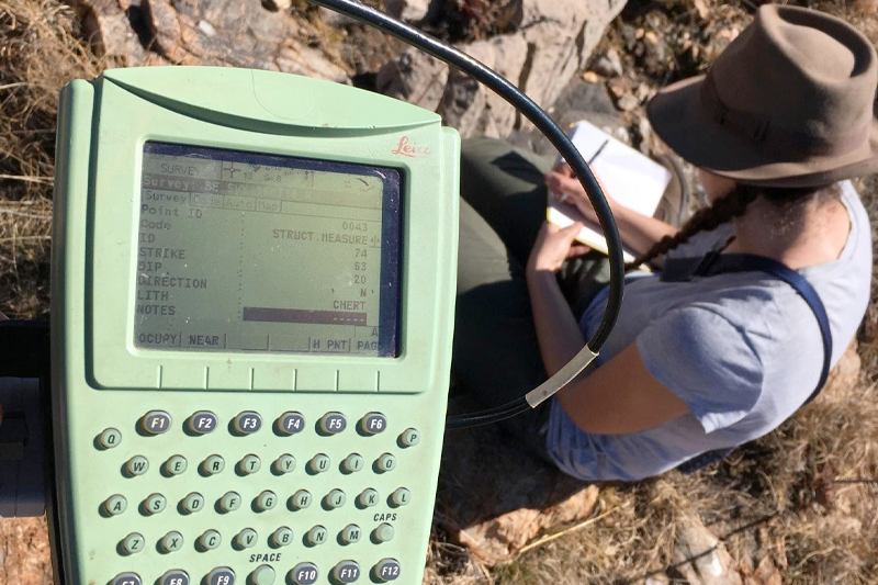 Tara Edwards conducting structural geological mapping of the Bolt’s Farm surface