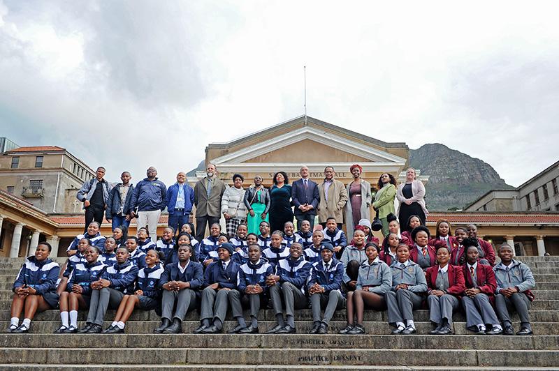 Learners and teachers from Makupula Secondary School and Zonnebloem Nest High School; the 2023 Stella Clark Teachers’ awardees; the award committee; and current and retired members of UCT staff, on the steps in front of the Sarah Baartman Hall on upper campus