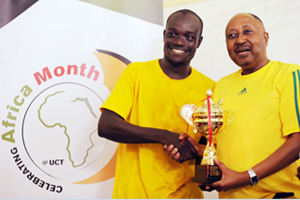 The spoils: A beaming Maxwell Amponsah-Dacosta (left), captain of the winning team, is congratulated by Professor Thandabantu Nhlapo on his teams' success.