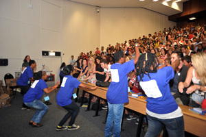 Cheery blues: New Humanities students get a rousing welcome from the blue-clad orientation leaders.