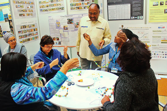 Deputy Vice-Chancellor Professor Thandabantu Nhlapo shares some words of encouragement for staff who participated in the painting and beading workshop, hosted as part of Africa Month at UCT.