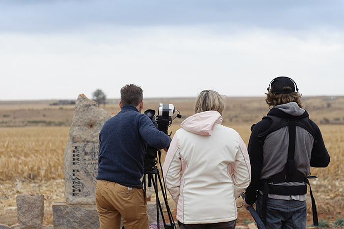 Meg Rickards (middle), co-director of the documentary <i>1994: The Bloody Miracle</i>, films the grave stone of EugÃ¨ne Terre'blanche in Ventersdorp during the production of film.
