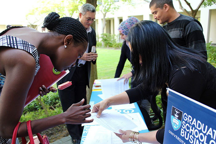 Potential students registering for a Postgraduate Diploma in Management Practice information session at the Graduate School of Business' Social Innovation Lab on 15 September 2014.