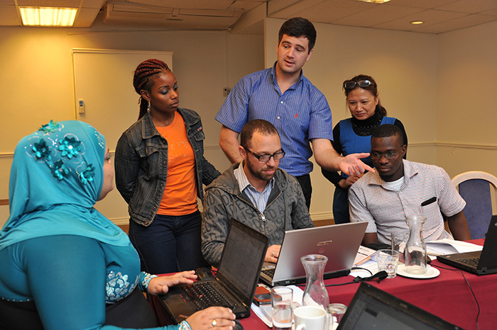 In training: Oren Jalon (centre, seated), an epidemiologist in Malawi, with fellow TIER.Net workshop participants (from left) Natacha Gomas Dos Santos, Mozambican data manager; Artemisa Julieta Uqueio Matsinhe, Mozambican data manager; Robin Burley, workshop facilitator from UCT; Dr Nguyen Thi Lan Huong, Vietnamese epidemiologist; and Walter Macueia, Mozambican data manager.