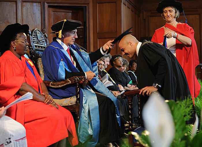 Singer Matthew Peter le Roux, better known by his stage name Jimmy Nevis, was among the humanities graduates. Here he is being capped by Vice-Chancellor Dr Max Price for a Bachelor of Social Science degree.