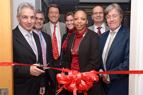 The ribbon cutting for Strait Access Technologies' new facilities at the Christiaan Barnard building in the Faculty of Health Sciences in late June 2014. UCT Vice-Chancellor Dr Max Price together with Dean of Health Sciences Prof Wim de Villiers, SAT Medical Director and CEO Prof Peter Zilla, SAT Chief Operations Officer Heather Coombes, Technology Innovation Agency Group Executive Dr Sibongile Gumbi, SAT Technical Director Dr Deon Bezuidenhout, and SAT Chairman and Scientific Director Prof David Williams. Photo by Hetty Zantman.