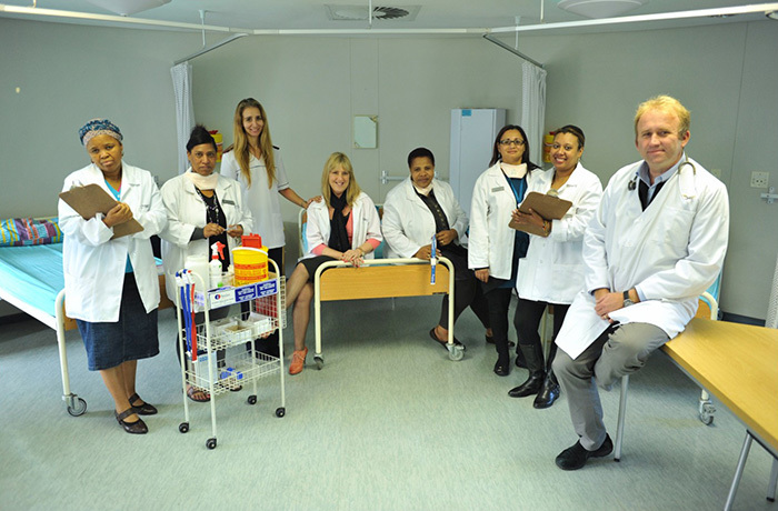 Teamwork: Dr Rod Dawson (right) and his team of (from left) Thami Mlonyeni, Bernie Isaacs, Michelle Evreva, Dr Kim Narunsky, Gloria Vusani, Lizette Rooi, and Suraya Beukes. The UCT team is part of an international research group working to produce more effective, less expensive and shorter TB treatment using a new combination of drugs