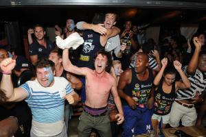 Exuberant fans celebrate the Ikey Tigers' fantastic Varsity Cup victory at The Toad &amp; Josephine in Newlands, Cape Town. 