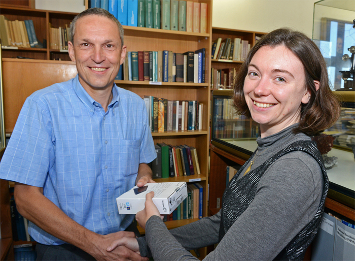 Shell's Piet Lambregts hands over some of the high-quality three-dimensional seismic data, collected off the West Coast of South Africa, to Dr Beth Kahle.