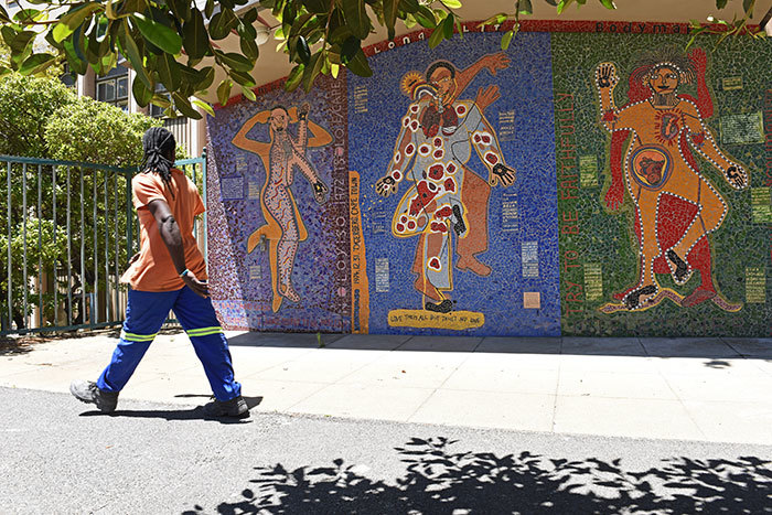 Three body maps on the outer wall of UCT's Medical School library trace the outlines of a story of health and HIV – how the virus entered the body, and how a life journey has changed course since that time. These illustrations were made by three women in the Bambanani Group, and translated into mosaic by Lovell Friedman.