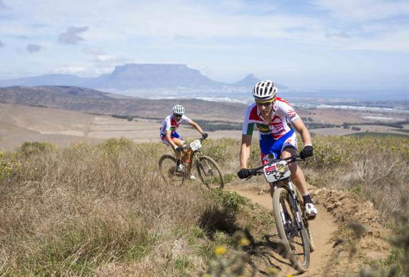 In the photo are this year's firm favourites to win, Swiss rider Christoph Sauser (back) and his Czech partner Jaroslav Kulhavy from the Investec-Songo-Specialised team. The photo was taken at last year's prologue at Meerendal by Nick Muzik.