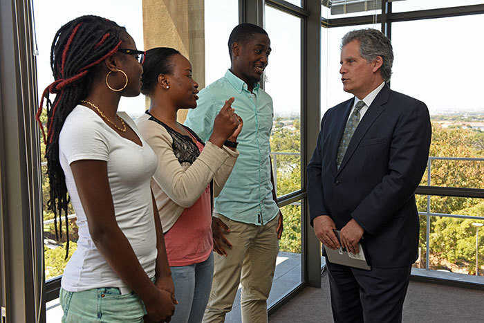 Engaging students: left to right, fourth year UCT economics students Felicia Ajose, Ruby Sam-Kputu and Louis Moussi Sopp speak with David Lipton, IMF's first deputy managing director.