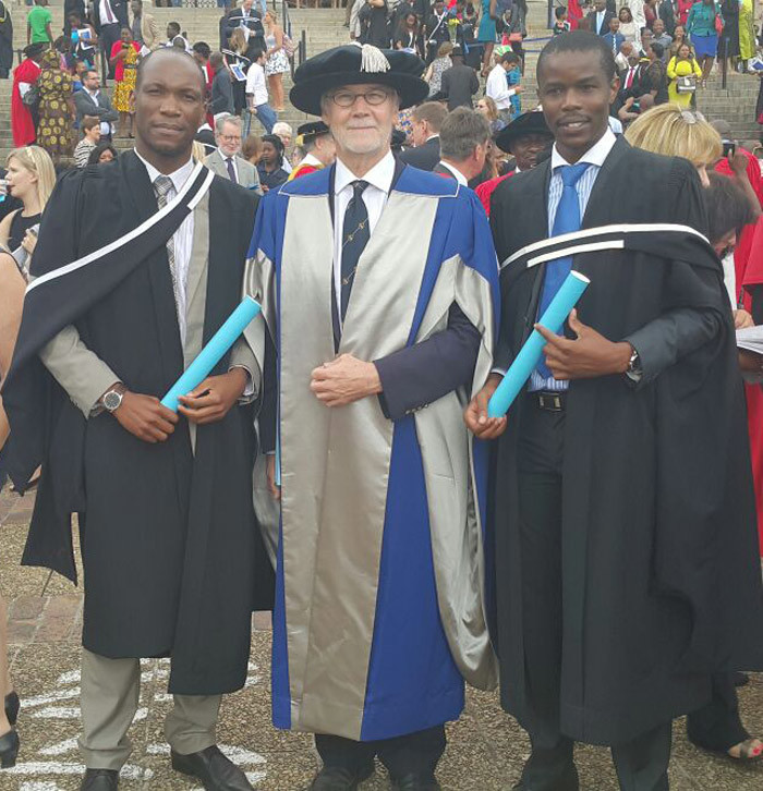 From left Gilbert Hwani, DVC Prof Danie Visser and Washington Zindoga outside Jammie Hall after Hwani and Zindoga became the first graduates to come from the Mastercard Foundation Program.