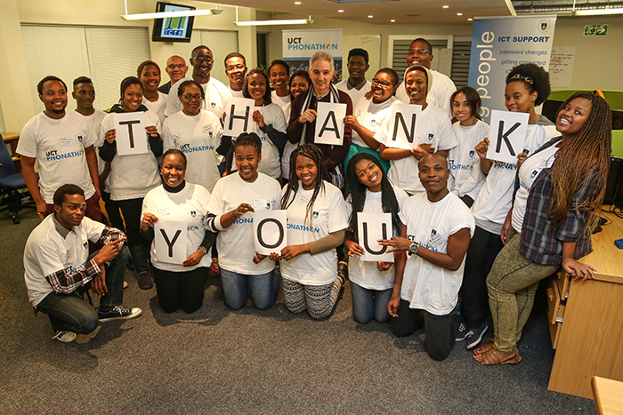 UCT Phonathon participants spell out their thanks to alumni with Vice-Chancellor Max Price during his visit to the call room.