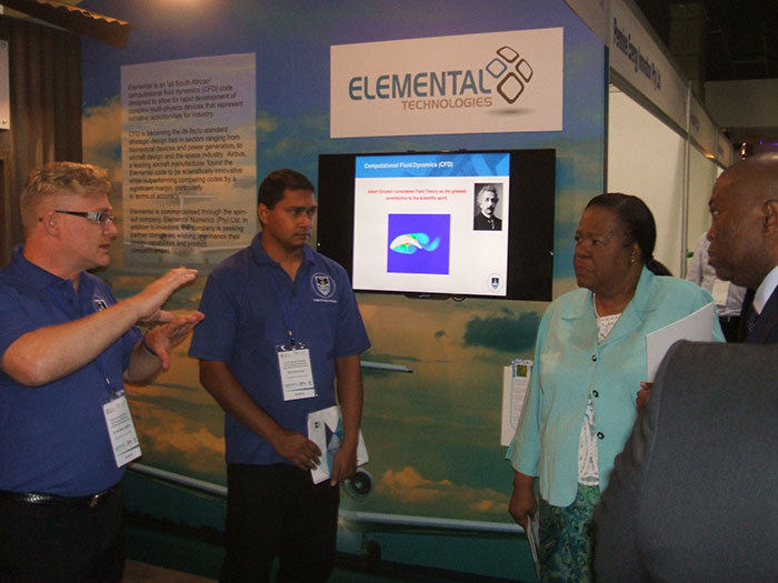 Dr Andrew Bailey and Dr Revel Iyer of the RCIPS team with the Minister of Science and Technology, Naledi Pandor, and the DG of Science and Technology, Dr Phil Mwjara. The UCT stand stood out, with a simulated shack, highlighting where the Lumkani fire detector is making an impact.