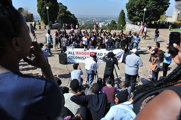 Representatives of the Rhodes Must Fall movement address the media and students at a press conference on Jammie Plaza after the end to the movement's occupation of Bremner.