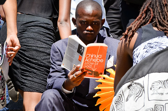 I read what I like: As part of the 2015 Infecting the City public arts festival, 100 youth took to the streets of Cape Town with their favourite African authors as part of the #100AfricanReads installation. (Photo by Lisa Burnell, courtesy of the Cape Town Partnership.)