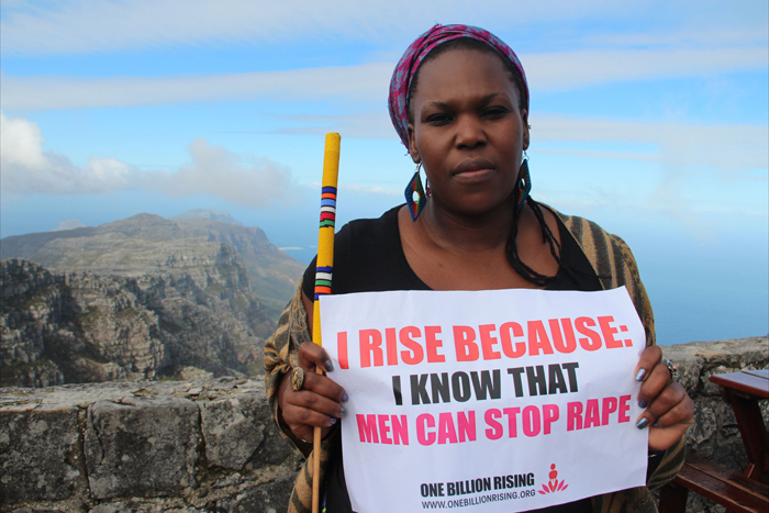 South African actress Andrea Dondolo on Table Mountain in Cape Town, as part of One Billion rising, to call for an end to violence against women and girls. Image by Lindsay Mgbor/Department for International Development [<a href="http://creativecommons.org/licenses/by/2.0)">CC&nbsp;BY&nbsp;2.0</a>], via Wikimedia Commons.