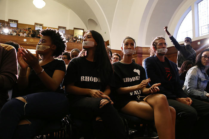 At the University Assembly on 25 March 2015, held so that staff and students might air their views on the #RhodesMustFall debate, Jameson Hall was filled to capacity. Many students came wearing tape over their mouths.