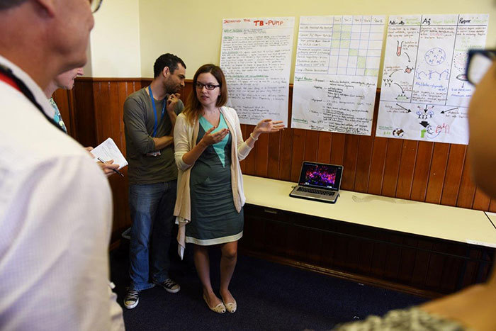 Collaboration: Ashley Jacobs and Joana Alcada explain their winning proposal to judges (not in picture is the third member of the group, Tim Ellis). Their proposal for a TB pump to control lung damage and repair tissue damage won first place during the week-long Imperial College/UCT Global Health Fellows Programme.