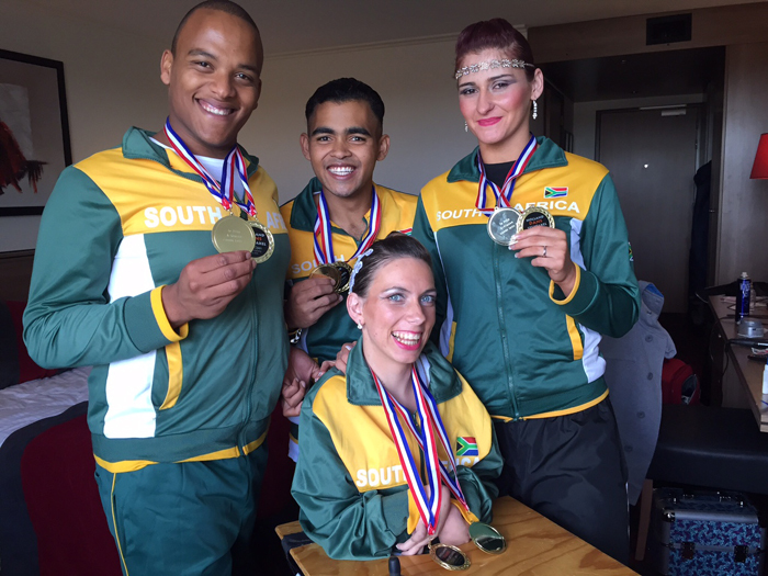 Double world champions: Showing off their hard-earned bling are (from left) Damian Michaels, Mukhtar Lee, Chantelle le Roux and Chaeli Mycroft (front).