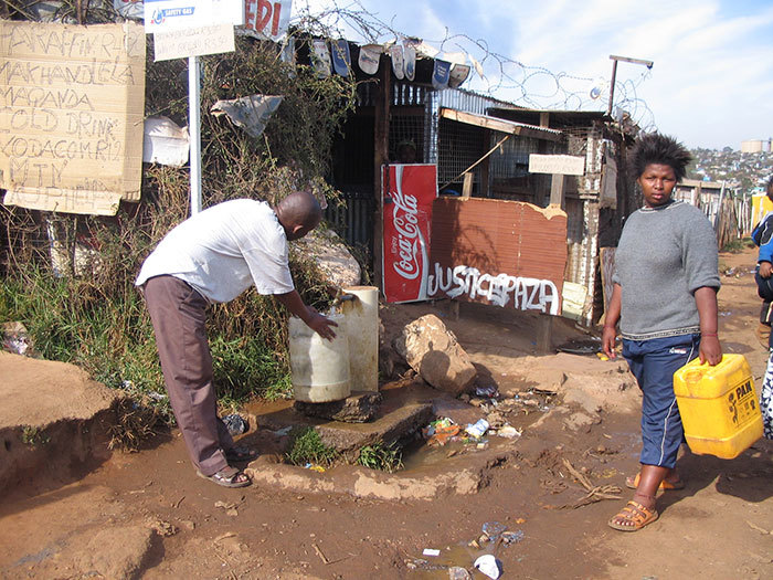 Communal tap for drinking water in Soweto, Johannesburg. <a href="http://commons.wikimedia.org/wiki/File:Communal_tap_(standpost)_for_drinking_water_in_Soweto,_Johannesburg,_South_Africa_(2941729790).jpg" target="_blank">Photo courtesy of Sustainable Sanitation Alliance.</a>, accessed via Wikimedia Commons. 