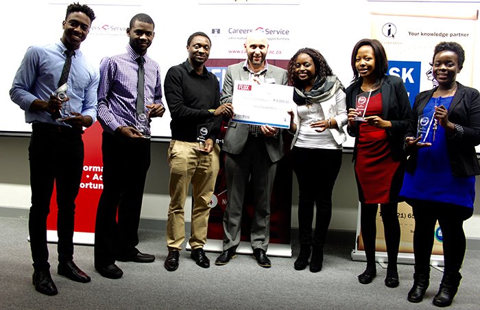 Winners of FLUX 2015 receive their prize of R9 000. They are from left Joshua Ojo-Aromokudu, Vogel Kayombo, Shingirayi Zimunhu, David Casey, director of UCT Careers Service, Ropafadzo Musvaire, Christabel Kunyongana and Michelle Chesa.