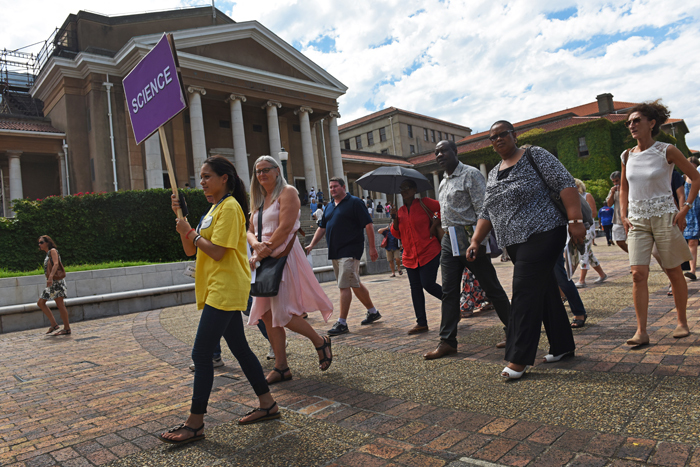 Student guides directed freshers' parents and guardians between the venues where parent orientation took place.