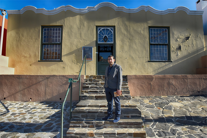 PhD scholar Halim Gencoĝlu outside the Bo-Kaap Museum at 71 Wale Street. His archival research reveals a case of mistaken identity in the museum's ownership.