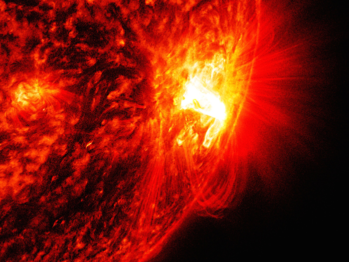 Solar flares, like this one that occurred on 27 October 2014, fling magnetically charged matter to earth, wreaking havoc but also sparking incredible light shows such as the aurora borealis.