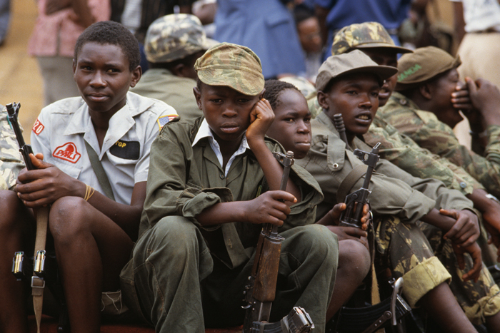 Child soldiers watch the inauguration of Yoweri Museveni as president of Uganda in 1986. Photo: William Campbell / Sygma via Getty Images