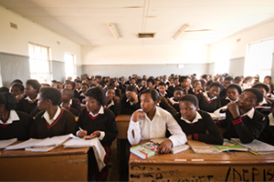 From 23 to 26 April 2013, Archbishop Thabo Makgoba led a delegation of eminent South Africans (which included Professors Njabulo Ndebele and Pierre de Vos) on a 'solidarity visit' to schools in the Eastern Cape. On the second day, they visited Ntapane Senior Secondary School, where there were 135 learners in one Grade 9 classroom (seen here), sitting three or four to a desk. Teachers stood pressed up against the blackboard, and contact with learners at the back of the class was almost impossible. Photo by Sydelle Willow Smith.