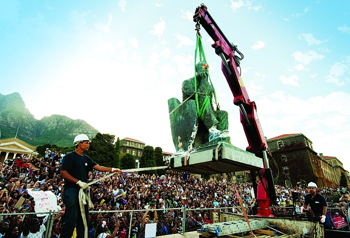 Going, going, gone: The colossus of Rhodes is removed from its plinth on upper campus, and students rise to take his place.