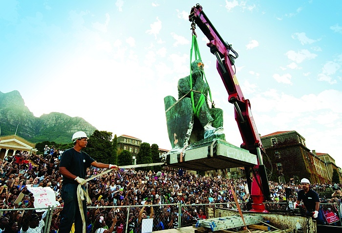 Going, going, gone: The colossus of Rhodes is removed from its plinth on upper campus, and students rise to take his place.