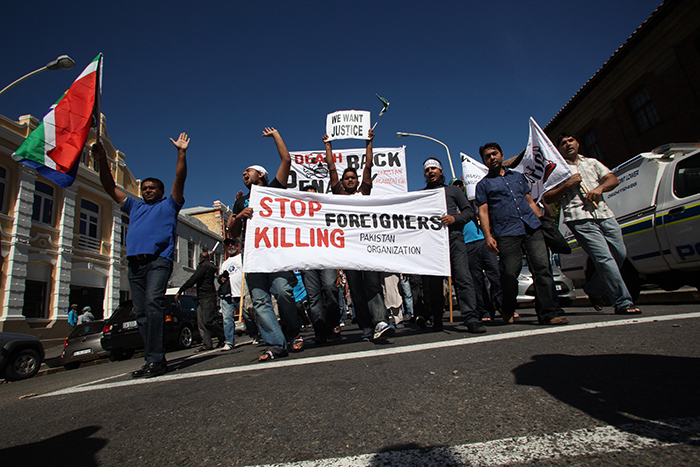 Xenophobic violence reared its ugly head in South Africa again this year. Here Pakistani and Somali nationals are photographed protesting in Cape Town against bail being granted to suspects arrested for the murder of four Pakistanis in 2013. Photo by Shelley Christians, Gallo Images.