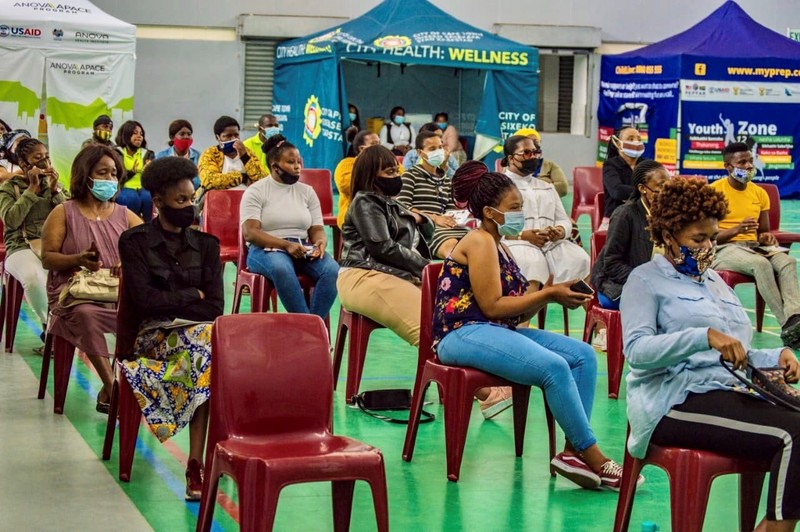 Youth from Khayelitsha listening to health representatives' talks on HIV research, prevention and treatment in COVID-19 times on World AIDS Day 2020.