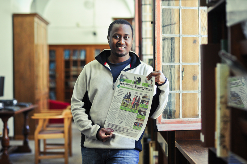 Breaking barriers: Unathi Kondile poses with a copy of the revived Isigimidi SamaXhosa.