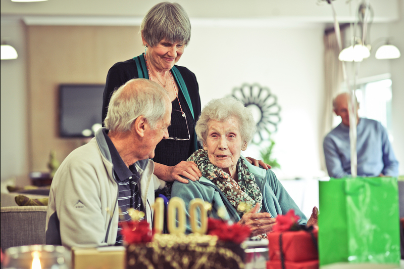 100 up: Centenarian Emer Prof Morna Mathias, with her daughter, Iona, and pastor, John Broom, at the celebration of her milestone birthday on 20 May.