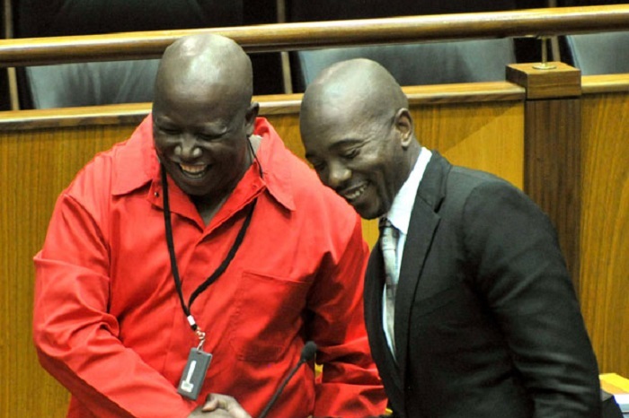 Economic Freedom Fighters (EFF) leader Julius Malema shakes hands with Democratic Alliance (DA) leader Mmusi Maimane after addressing Parliament during the State of the Nation Address (SoNA) debate. Photo by GovernmentZA, accessed via <a href="https://www.flickr.com/photos/governmentza/14455739282" target="_blank">flickr</a>.