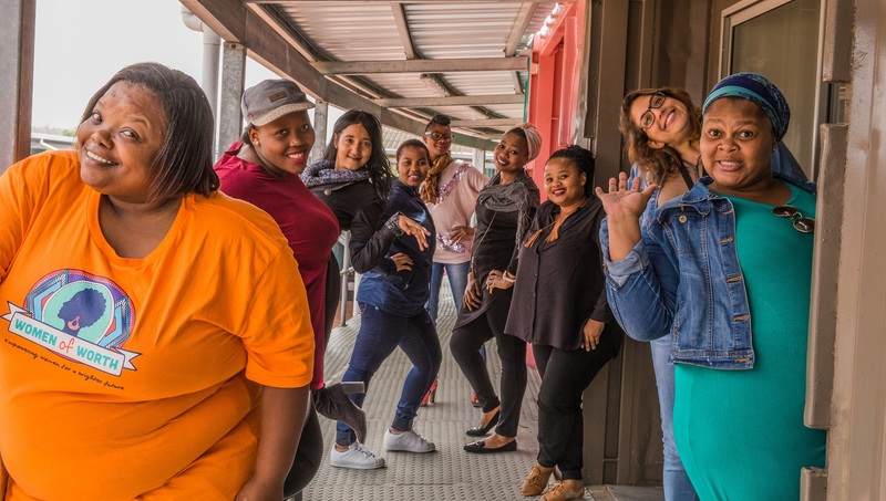 Women of Worth facilitators strut their stuff at the Philippi Village Container Walk, where the office is located.