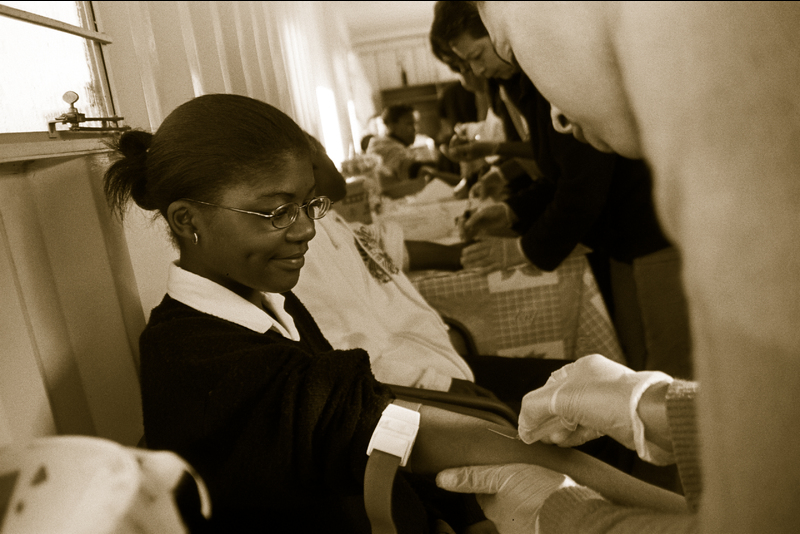 SATVI nurse examining a participant in this study, which followed adolescents infected with M. tuberculosis (latent TB) over several years in the Worcester area.