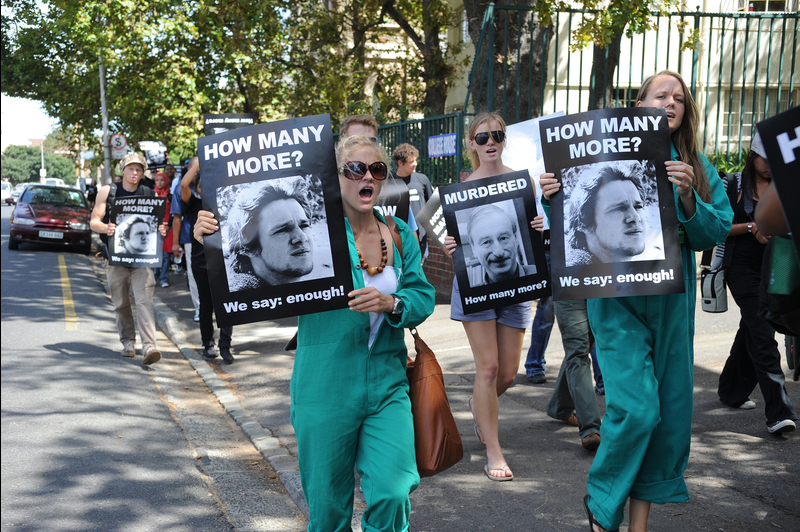 We say enough: Students carrying placards protest fellow student Dominic Giddy's murder three years ago when the UCT community marched to demand action against violent crime. The community will march again on Wednesday 20 February to protest a new spate of violent crime.